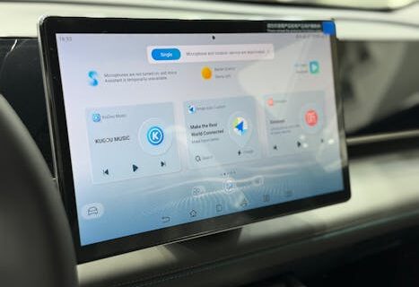 Modern car dashboard featuring a digital touchscreen interface with multiple apps.